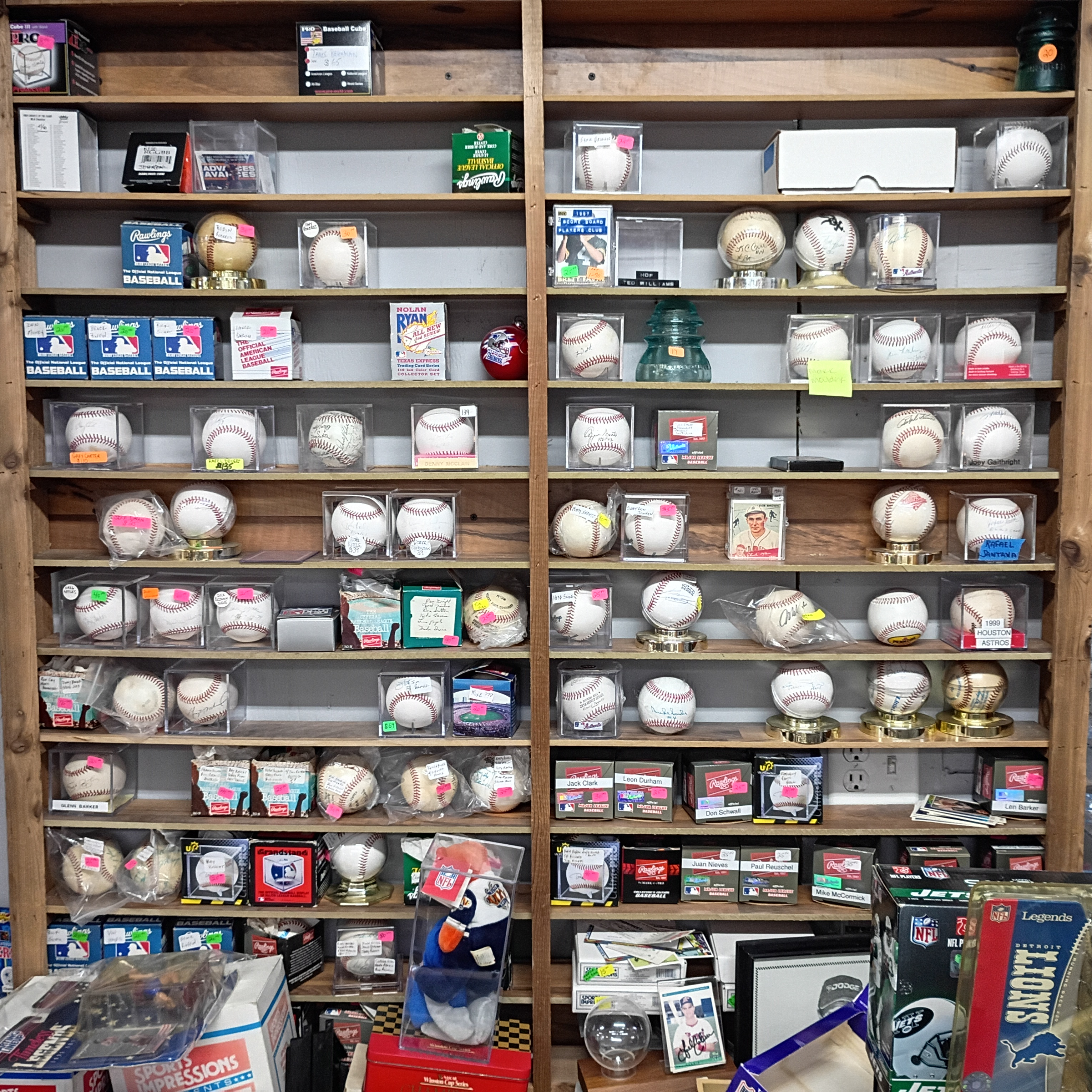 Shelves of baseballs in display cases at Finn McCool's in Daytona Beach.